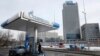 A Gazprom Neft gas station in Moscow with Gazprom headquarters in the background