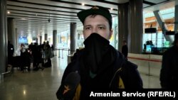 Armenia - Alexei, a 25-year-old Russian copywriter, talks to RFE/RL at Yerevan's Zvartnots airport, March 4, 2022
