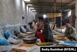Women work inside a bakery run by a charity in the southern Afghan city of Kandahar.