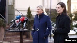 Finnish Prime Minister Sanna Marin (right) and Swedish counterpart Magdalena Andersson speak to the media outside her official residence in Helsinki on March 5.