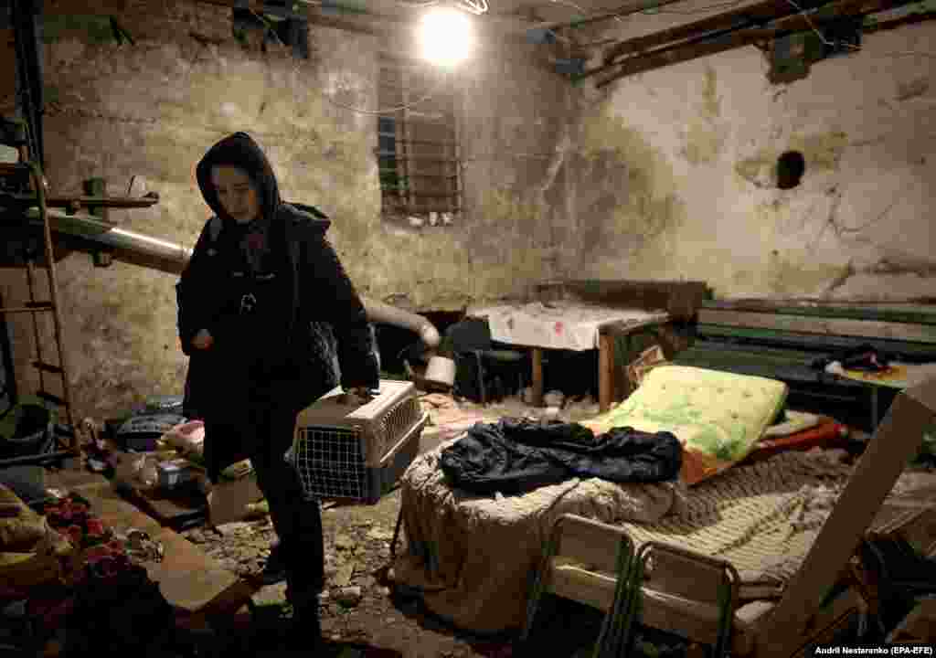 A volunteer waits for the end of curfew in the basement of a building in Kyiv on March 7. Thousands of Kyiv civilians are currently sheltering underground in basements that double as bomb shelters, and in the city&#39;s subway system, amid fears Russia will launch missiles into the center of the capital.&nbsp;