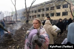 Hospital patients are evacuated after the attack in Mariupol on March 9.