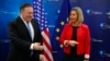 U.S. Secretary of State Mike Pompeo is welcomed by EU Foreign Policy chief Federica Mogherini ahead of a meeting at the EEAS building in Brussels, July 12, 2018