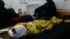 An Afghan boy receives treatment at a hospital after an air strike in Helmand Province.