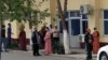 Turkmenistan. People in masks waiting for bread delivery to grocery. Ashgabat. April, 2022 