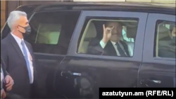 Uruguay - Turkey's Foreign Minister Mevlut Cavusoglu makes a hand gesture associated with a Turkish ultranationalist group to Armenians protesting against his visit to Montevideo, April 23, 2022.