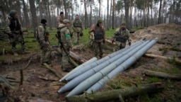 Ukrainian soldiers examine missiles abandoned by Russian troops in the village of Berezivka on April 21. Russia has suffered "significant" losses in men and equipment in the eight weeks of war.