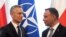 NATO Secretary-General Jens Stoltenberg (left) and Polish President Andrzej Duda speak in Warsaw on May 28.