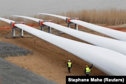 Technicians inspect wind turbine blades at Saint Nazaire, France, in 2012.