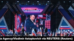 Владимир Путин во время митинг-концерта на стадионе «Лужники» в Москве, 18 марта 2022 года