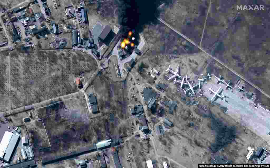 By using the multispectral imagery bands on the WorldView-2 satellite, the Maxar photos show damage to buildings and fuel storage tanks on fire at Antonov International Airport near Hostomel, northwest of Kyiv.