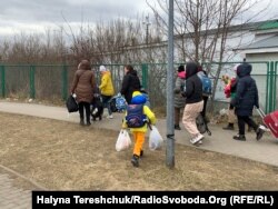 Біженці на українсько-польському кордоні в Шегині. Лютий 2022 року