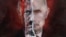 A poster depicting Russian President Vladimir Putin is displayed during a protest rally in front of the Russian Embassy in Riga, Latvia, on March 17.&nbsp;