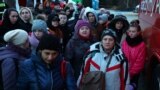 UKRAINE-CRISIS/BORDER-POLAND -- Refugees from Ukraine wait to board a bus to Warsaw after crossing the border from Ukraine to Poland, fleeing the Russian invasion of Ukraine, at border checkpoint in Kroscienko, Poland, March 17, 2022
