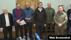 The Czech Republic's Petr Fiala (2nd left), Slovenia's Janez Jansa (3rd left), Poland's Mateusz Morawiecki (4th left) look on as Ukraine's Volodymyr Zelenskiy speaks to the press after a meeting in Kyiv on March 15.