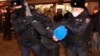 Police officers detain a demonstrator during a protest against Russia's invasion of Ukraine in Moscow on February 24.