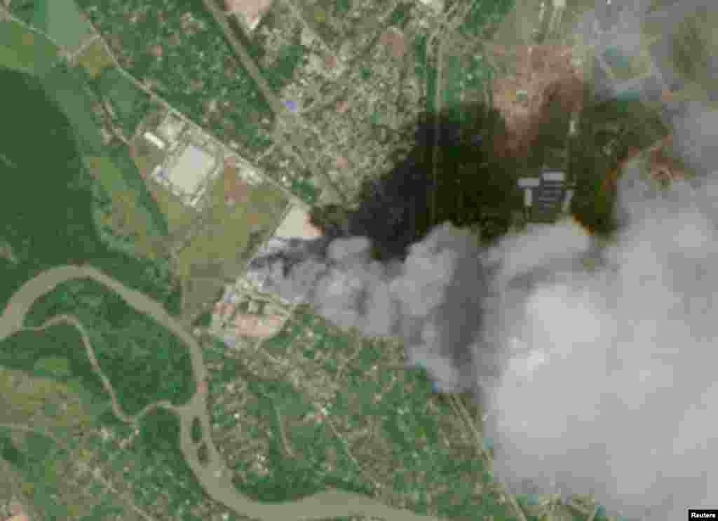 A satellite view shows smoke billowing from a Wildberries facility in Nevinnomyssk, Russia, on July 22. The handout images were captured by the European Union's Copernicus Sentinel-2 satellite.