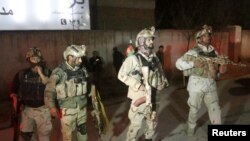 Afghanistan - Members of Afghan Crisis Response Unit (CRU) arrive at the site of a Taliban attack in the Afghan capital of Kabul, Afghanistan December 11, 2015