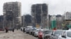 Civilians seek to leave the besieged port city of Mariupol by car on March 17.