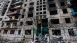 Последствия попадания российской ракеты в жилой дом в Киеве. 14 марта 2022 года
