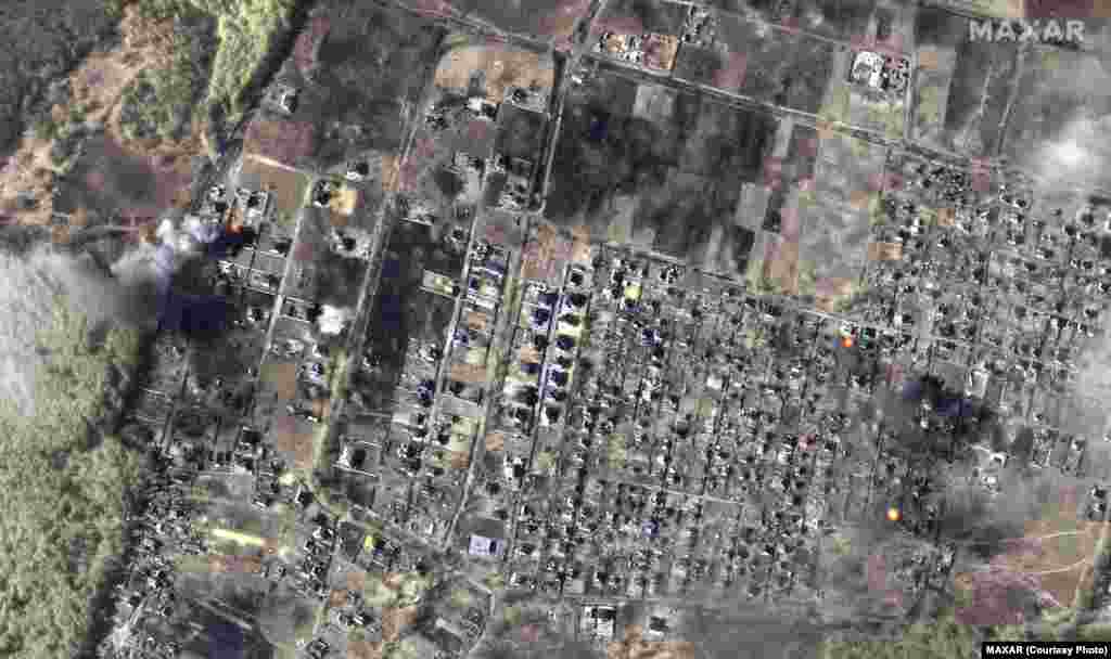 A color infrared view of burning homes in Moschun, a northwestern suburb of Kyiv, on March 14.