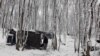 Bosnia and Herzegovina, Velika Kladusa, Migrants in makeshift unconditional tents in the woods during snowfall, January 11 2021