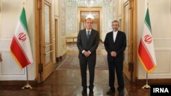 The EU's chief negotiator on the Iranian nuclear deal, Enrique Mora (left), poses with Ali Bagheri, Iran's chief negotiator. (file photo)
