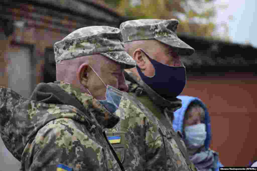 Servicemen attend a Defenders Day event in Kharkiv.