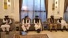 Taliban delegates meet with Qatari delegates in Doha. 