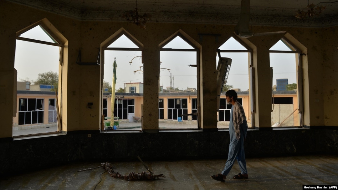 A man inspects damage at the Gozar-e Sayed Abad Mosque a day after a suicide bombing in Kunduz on October 9.