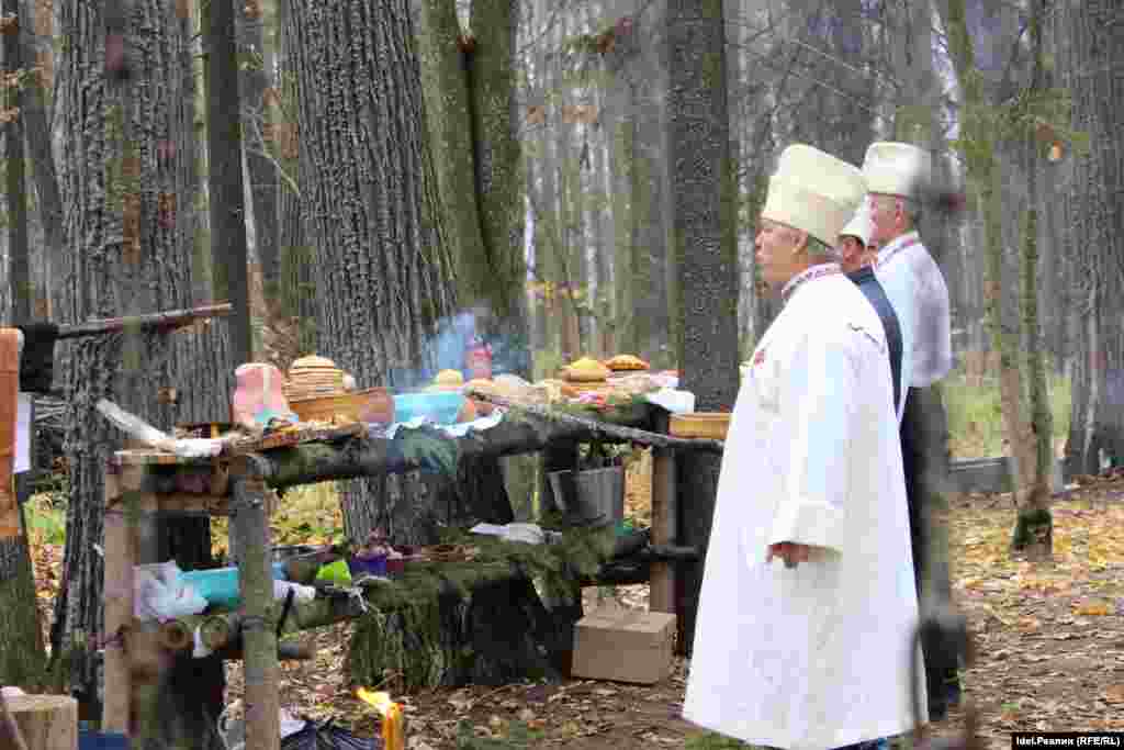 Mari priests wave a smouldering stick during the autumn ceremony.&nbsp;