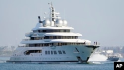 The super yacht Amadea sails into the San Diego Bay on June 27, 2022. The $325 million superyacht was seized by the United States from a sanctioned Russian oligarch.