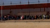 Hundreds of migrants prepared to camp in the cold at Mexico's northern border over Christmas