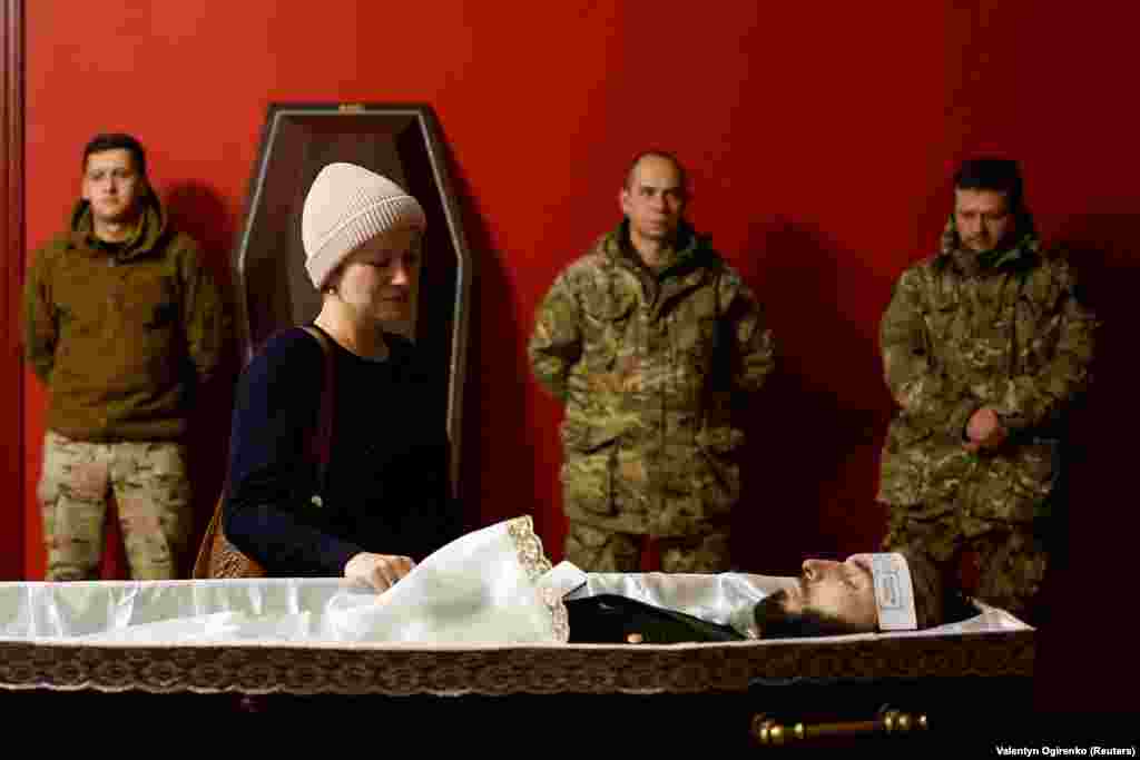Colleagues and friends attend a funeral for Ukrainian soldier and ballet dancer Vadym Khlupyanets, who was recently killed while fighting Russian troops, at the National Academic Operetta&#39;s Theater in Kyiv on November 24.