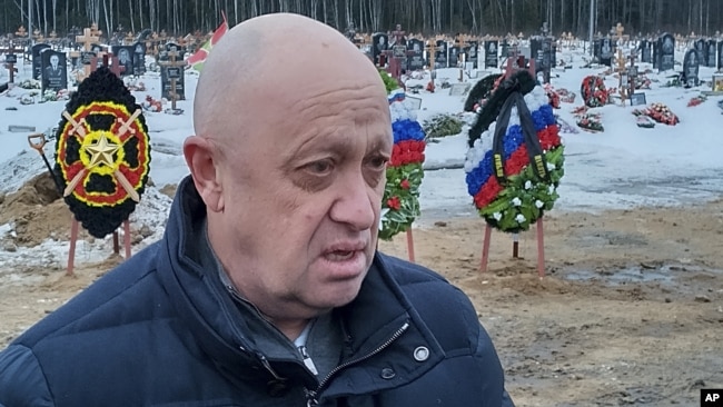 Vagner founder Yevgeny Prigozhin is seen at the funeral of one of his mercenaries -- prisoner Dmitry Menshikov, who died fighting in Ukraine -- at a cemetery outside St. Petersburg on December 24.