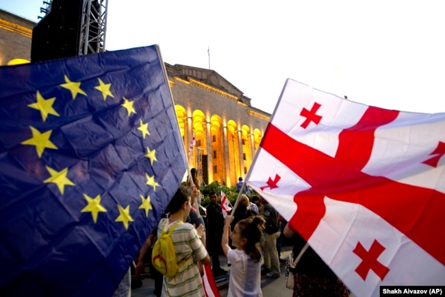 Demonstrators gather at a pro-EU and anti-government rally in front of the Georgian parliament in Tbilisi on July 3.