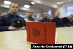 A military ID is pictured at an assembly station of the Leningrad Region military commissariat where conscripts are briefed ahead of departing for military service with the Russian Army in November 2022.