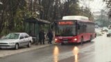 People at the bus stop entering in a bus in Skopje North Macedonia