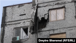 Пошкоджений російськими ударами будинок у Херсоні, грудень 2022 року