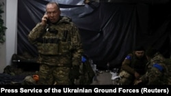 The commander of Ukraine's ground forces, Colonel General Oleksandr Syrskiy, visits the positions of soldiers on the front line in the city of Soledar on January 9.