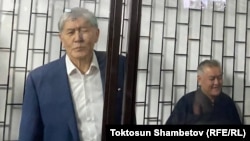 Former Kyrgyz President Almazbek Atambaev (left) in court in Bishkek in December.