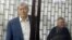Former Kyrgyz President Almazbek Atambaev (left) in court in Bishkek in December.