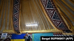 A volunteer in an initiative dubbed the Yurt Of Invincibility, organized by Kazakh diaspora members in Ukraine and set up in the town of Bucha, on January 9, 2023.