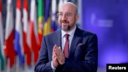 European Council President Charles Michel called the EU leaders' decision a "strong signal to the people, but also a clear expectation for the new authorities to deliver on reforms."