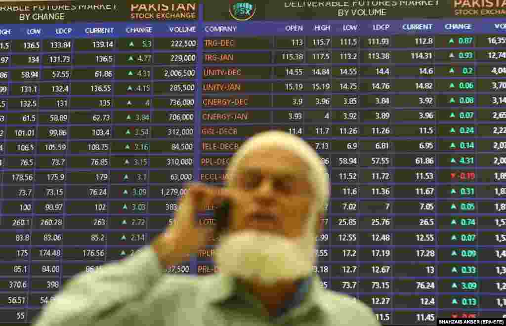 A Pakistani stockbroker monitors the latest share prices during a trading session at the Pakistan Stock Exchange in Karachi.&nbsp;