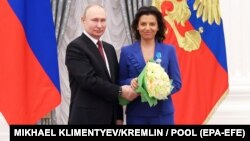 RUSSIA – Russia's President Vladimir Putin awards an Order of Honour to RT and Rossiya Segodnya editor-in-chief Margarita Simonyan at the Moscow Kremlin, December 20, 2022