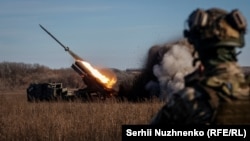 Ukrainian soldiers fire a Bureviy multiple-launch rocket system at a position in the Donetsk region on November 29.