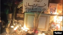 People gather at the grave of one of the protesters killed in the recent wave of protests in Iran on December 21.