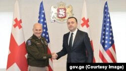 ირაკლი ღარიბაშვილი და კრისტოფერ კავოლი