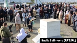 People gather for Bosnia-Herzegovina's statehood day at the memorial to the victims of genocide at the Srebrenica-Potocari Memorial Center on November 26, 2022.